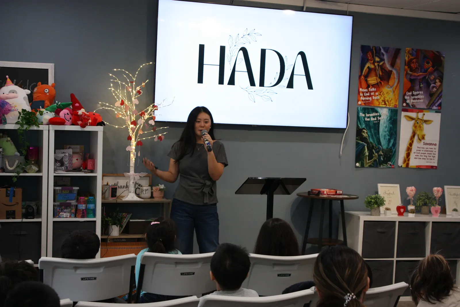 Jiny Yu, founder of HADA Ministries, speaking to a room